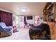 Living room featuring a TV, and exterior door at 100 Lanier St, Mount Holly, NC 28120