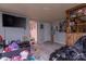 Living room with gray floors, large tv, and shelves at 100 Lanier St, Mount Holly, NC 28120