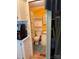 Compact bathroom featuring a toilet, sink, storage, and a shower with a colorful curtain at 102 Papoose Ct # D117, Mount Gilead, NC 27306