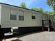 Home featuring a side entrance with a small deck, providing easy access and outdoor space at 102 Papoose Ct # D117, Mount Gilead, NC 27306