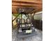 Rear view of the golf cart under shelter, highlighting its seating and license plate at 102 Papoose Ct # D117, Mount Gilead, NC 27306