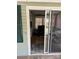 View of a well-lit living room featuring hardwood floors and stylish furniture through a sliding glass door at 102 Papoose Ct # D117, Mount Gilead, NC 27306