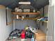 Interior of the storage shed, featuring shelving with various containers and equipment stored inside at 102 Papoose Ct # D117, Mount Gilead, NC 27306