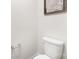 Modern bathroom featuring a toilet, artwork, and a neutral color palette at 1053 Horizon Ln, Chester, SC 29706