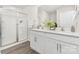 Bright bathroom features a double vanity and tiled walk-in shower at 1053 Horizon Ln, Chester, SC 29706