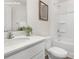 Bright bathroom featuring a large white vanity, framed art, and a shower/tub combo at 1053 Horizon Ln, Chester, SC 29706