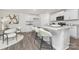 The kitchen features an eat-in island with white cabinets, granite countertops and stainless appliances at 1053 Horizon Ln, Chester, SC 29706