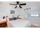 Bright bedroom with ceiling fan, modern lighting, a comfortable bed, and serene decor, perfect for relaxation at 115 E Park Ave # 428, Charlotte, NC 28203