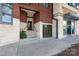 Welcoming brick building entrance with steps and a secure exterior door at 115 E Park Ave # 428, Charlotte, NC 28203