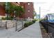 Brick building exterior with an adjacent rail line for easy access to the city at 115 E Park Ave # 428, Charlotte, NC 28203