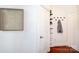 Bright hallway featuring coat hooks, wall art, and a shelf, enhancing the home's storage and decorative appeal at 115 E Park Ave # 428, Charlotte, NC 28203
