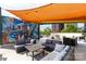 Relax on this rooftop patio with stylish seating, shaded area, and mural art at 115 E Park Ave # 428, Charlotte, NC 28203