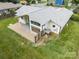 Aerial view of the home with white exterior and large lot including a covered patio at 1207 Lakedell Dr, Charlotte, NC 28215