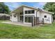 Exterior rear of the home showcasing a covered patio and modern architectural design at 1207 Lakedell Dr, Charlotte, NC 28215