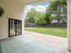 Covered patio overlooking a spacious backyard with a storage shed and privacy fence at 1207 Lakedell Dr, Charlotte, NC 28215