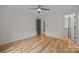 Inviting bedroom with hardwood floors, neutral walls, and a door to the closet and en-suite bathroom at 1207 Lakedell Dr, Charlotte, NC 28215