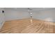 Empty bedroom with hardwood floors, ceiling fan, air conditioning, and natural light at 1207 Lakedell Dr, Charlotte, NC 28215