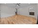 Primary bedroom with hardwood floors leading to the Primary bath featuring double sinks and neutral paint at 1207 Lakedell Dr, Charlotte, NC 28215