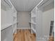 Bright, spacious walk-in closet with built-in shelving for ample storage and organization at 1207 Lakedell Dr, Charlotte, NC 28215