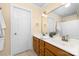 Bathroom vanity with double sinks, linen closet, and large mirror at 122 Waterford Dr, Mooresville, NC 28117
