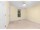 Well-lit bedroom with a neutral carpet and paint, ceiling fan, and white trim at 122 Waterford Dr, Mooresville, NC 28117