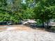 Sandy lot leading to multiple boat slips on the lake surrounded by trees at 122 Waterford Dr, Mooresville, NC 28117