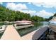 Close up view of multiple boat docks and boats on the lake in a wooded area at 122 Waterford Dr, Mooresville, NC 28117