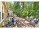 A large wooden deck offers outdoor seating and views of the lush backyard at 122 Waterford Dr, Mooresville, NC 28117