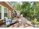 Relax on this large deck with comfortable lounge chairs, overlooking the serene backyard and mature trees at 122 Waterford Dr, Mooresville, NC 28117