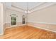 Dining room featuring neutral walls and ceilings and large windows with backyard views at 122 Waterford Dr, Mooresville, NC 28117
