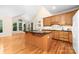 Well-lit kitchen featuring wooden cabinets, granite countertops, and a spacious island at 122 Waterford Dr, Mooresville, NC 28117