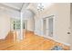 Spacious living room featuring hardwood floors, a decorative pillar, and lots of natural light at 122 Waterford Dr, Mooresville, NC 28117
