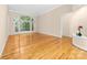 Bright living room with hardwood floors and a large window showcasing the outdoor view at 122 Waterford Dr, Mooresville, NC 28117