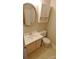 Bathroom featuring a white vanity, toilet, and shower-tub combo with updated fixtures at 1245 Paddock Cir, Charlotte, NC 28209