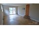 Inviting living room featuring sliding glass doors, providing seamless indoor-outdoor living at 1245 Paddock Cir, Charlotte, NC 28209