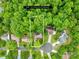 Aerial view showcases home's location on a spacious lot with mature trees and community surroundings at 125 Canopy Ct, Mooresville, NC 28115