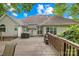 Backyard with patio and wooden deck, perfect for outdoor dining and entertaining at 125 Canopy Ct, Mooresville, NC 28115