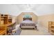 Bedroom features a ceiling fan, neutral walls, a window and shelving space for storage and decor at 125 Canopy Ct, Mooresville, NC 28115