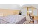 Bedroom features a ceiling fan, neutral walls, a window, and built in shelves for decor and storage at 125 Canopy Ct, Mooresville, NC 28115