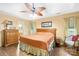 Traditional bedroom with a ceiling fan, wood furniture, and tan walls for a warm, inviting feel at 125 Canopy Ct, Mooresville, NC 28115