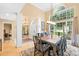 Bright dining room featuring a large window, hardwood floors, and elegant chandelier at 125 Canopy Ct, Mooresville, NC 28115