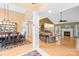 Open floor plan with dining area, living room, and fireplace at 125 Canopy Ct, Mooresville, NC 28115