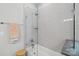 Bright bathroom features a shower-tub with glass enclosure and light gray tile at 127 Wickersham Dr, Statesville, NC 28625
