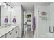 Bright and modern bathroom with glass shower and grey tile, viewed from vanity in the home at 127 Wickersham Dr, Statesville, NC 28625