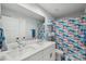 Bathroom featuring a double sink vanity with a shower and colorful shower curtain at 127 Wickersham Dr, Statesville, NC 28625