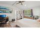Bright bedroom features vaulted ceiling, ceiling fan, entertainment center, and access to ensuite bath at 127 Wickersham Dr, Statesville, NC 28625