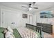 Bedroom featuring a ceiling fan, television, and large windows for ample natural light at 127 Wickersham Dr, Statesville, NC 28625