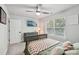 Bright bedroom features a ceiling fan, large window, and modern decor at 127 Wickersham Dr, Statesville, NC 28625