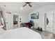 A spacious bedroom features vaulted ceiling, modern decor, and access to an ensuite bathroom and additional living space at 127 Wickersham Dr, Statesville, NC 28625