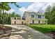 Charming two-story home featuring an attached garage and well-manicured lawn at 127 Wickersham Dr, Statesville, NC 28625